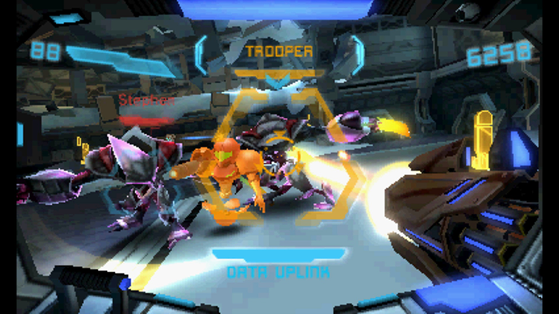 3DS games don’t show well in big screenshots. Federation Force further suffers from having a fairly plain look that doesn’t look good in stills. On the 3DS itself, the game looks good enough. It’s not the head-turner that the console Metroid Primes were, but the graphics get the job done. Here, you’re seeing from the perspective of GameXplain’s Derrick Bitner, who played through much of the game with me. I’m on the left side, obscured by a Space Pirate who is distracted by the Samus decoy I dropped into battle. Thanks to Derrick for the screencap.